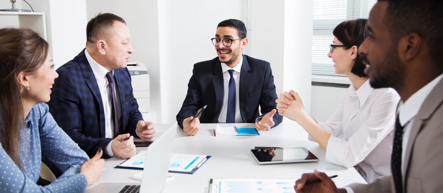 People discussing around a conference table